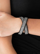 Load image into Gallery viewer, Infused with dainty gunmetal ball chain, glittery hematite rhinestones are sprinkled across a black suede band in a cube like pattern for an edgy look. The elongated band allows for a trendy double wrap design. Features an adjustable snap closure.  Sold as one individual bracelet.  Always nickel and lead free.
