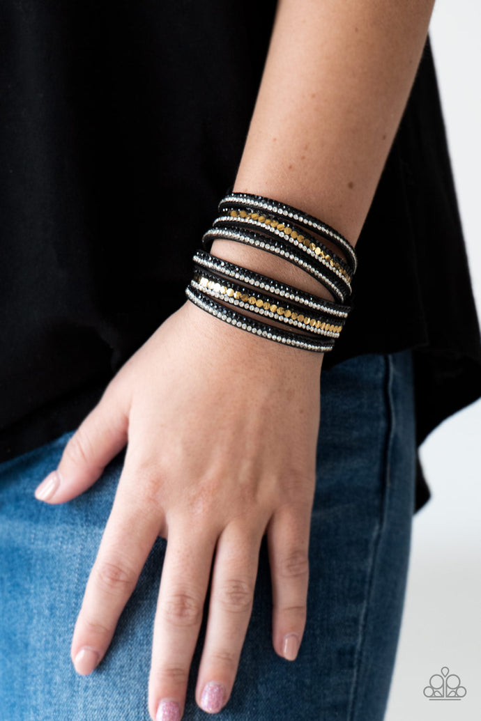 Encrusted in rows of glittery black and white rhinestones and flat gold studs, three strands of black suede wrap around the wrist for a sassy look. The elongated band allows for a trendy double wrap around the wrist. Features an adjustable snap closure.  Sold as one individual bracelet.  Always nickel and lead free.