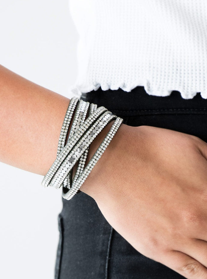 Encrusted in rows of glassy white rhinestones and flat silver studs, three strands of green suede wrap around the wrist for a sassy look. The elongated band allows for a trendy double wrap around the wrist. Features an adjustable snap closure.  Sold as one individual bracelet. 