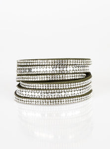 Encrusted in rows of glassy white rhinestones and flat silver studs, three strands of green suede wrap around the wrist for a sassy look. The elongated band allows for a trendy double wrap around the wrist. Features an adjustable snap closure. Sold as one individual bracelet.