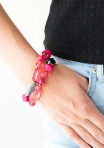 Mismatched gunmetal, polished pink, and crystal-like beads are threaded along interlocking stretchy bands for a whimsical look.  Sold as one individual bracelet.  