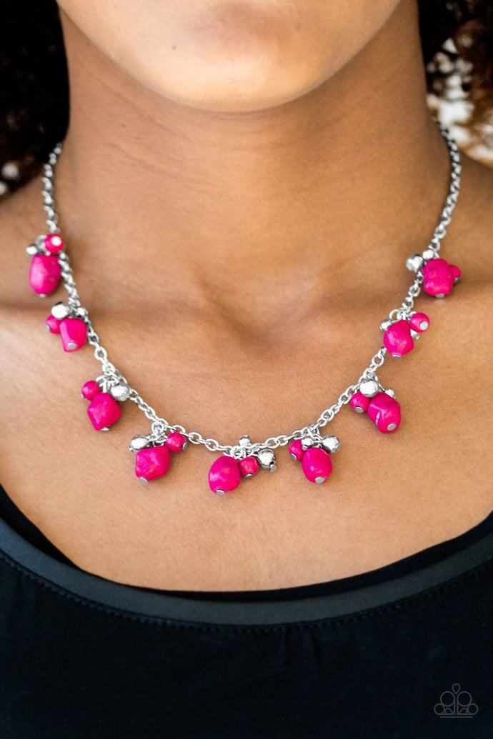 Varying in shape and size, shiny silver beads and vivacious pink stone beading swing from the bottom of a shimmery silver chain, creating a colorful fringe below the collar. Features an adjustable clasp closure.  Sold as one individual necklace. Includes one pair of matching earrings.