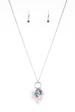 Load image into Gallery viewer, Infused with dainty multicolored pearls and a shimmery silver heart charm, a stenciled silver heart pendant swings from the bottom of a lengthened silver chain for a whimsical look. Features an adjustable clasp closure. Sold as one individual necklace. Includes one pair of matching earrings.