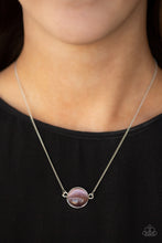 Load image into Gallery viewer, A glassy purple cat&#39;s eye stone attaches to a shimmery silver chain, creating a stationary pendant below the collar. Features an adjustable clasp closure.  Sold as one individual necklace. Includes one pair of matching earrings.  Always nickel and lead free.