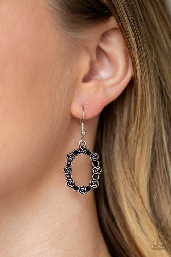 Dainty black rhinestones alternate with silver rosebud frames, coalescing into a whimsical floral frame. Earring attaches to a standard fishhook fitting.  Sold as one pair of earrings.  Always nickel and lead free.