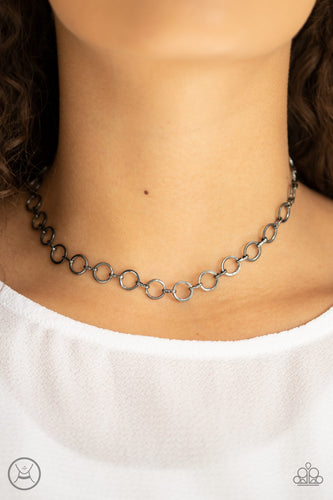 Dainty gunmetal rings link around the neck for a minimalist inspired shimmer. Features an adjustable clasp closure.  Sold as one individual choker necklace. Includes one pair of matching earrings.  Always nickel and lead free.