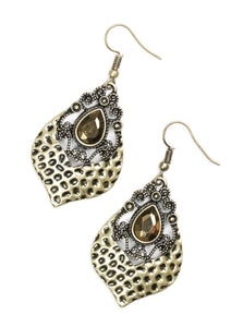 Cut into a regal teardrop, a faceted aurum rhinestone is pressed into an ornate lure. The bottom of the lure has been delicately hammered, adding shimmery texture to the regal palette. Earring attaches to a standard fishhook fitting.  Sold as one pair of earrings.