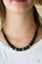Load image into Gallery viewer, Gradually increasing in size near the center, a strand of shiny black beads falls just below the collar. White rhinestone encrusted rings are sprinkled along the center for a timeless finish. Features an adjustable clasp closure.  Sold as one individual necklace. Includes one pair of matching earrings.   Always nickel and lead free.