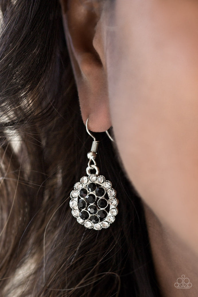 Dazzling white and black rhinestones are encrusted across a round silver frame, creating a blinding palette. Earring attaches to a standard fishhook fitting.  Sold as one pair of earrings.