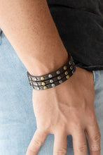 Load image into Gallery viewer, Split into three strands, antiqued brass and gunmetal beads are studded along the front of a brown leather band for a rustic look. Features an adjustable snap closure.  Sold as one individual bracelet.  Always nickel and lead free.