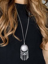 Load image into Gallery viewer, Swinging from the bottom of a lengthened silver chain, a dramatic gray stone gives way to an ornate crescent shaped frame dotted with a dainty gray stone. Brushed in an antiqued shimmer, flared silver bars swing from the bottom of the dramatic pendant, adding a playful movement to the seasonal palette. Features an adjustable clasp closure.  Sold as one individual necklace. Includes one pair of matching earrings.  Always nickel and lead free.