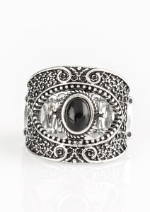 Embossed in shimmery filigree, glistening silver frames join around an earthy black stone center for a seasonal look. Features a stretchy band for a flexible fit.  Sold as one individual ring.