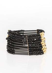 Joined together with metallic fittings, black seed beads are threaded along stretchy elastic bands. Sections of gold beads are sprinkled along the edgy layers, adding hints of shimmer to the seasonal palette.  Sold as one individual bracelet.