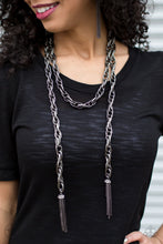Load image into Gallery viewer, A single strand of spiraling, interlocking links with light-catching texture is anchored by two tassels of chain that add dramatic length to the piece. Undeniably the most versatile piece in Paparazzi&#39;s history, the scarf necklace features FIVE different ways to accessorize: Open Layer, Loop, Traditional Wrap, Double Knot, and Nautical Knot.  Sold as one individual necklace. Includes one pair of matching earrings.