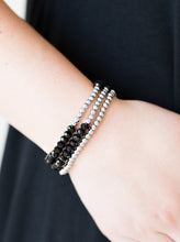 Load image into Gallery viewer, Brushed in an iridescent finish, faceted black beads and glistening silver beads are threaded along elastic stretchy bands, creating colorful layers across the wrist.  Sold as one set of three bracelets.