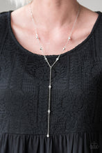 Load image into Gallery viewer, Sections of shiny silver, polished white, and glassy beads trickle along a shimmery silver chain along the chest for a flirtatious look. Features an adjustable clasp closure.  Sold as one individual necklace. Includes one pair of matching earrings.  Always nickel and lead free. 