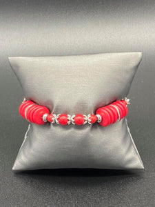 Featuring glistening silver accents, disc-shaped and round red stone beads are threaded along a stretchy band for a seasonal look.  Sold as one individual bracelet.  Always nickel and lead free.  Fashion Fix Exclusive July 2020
