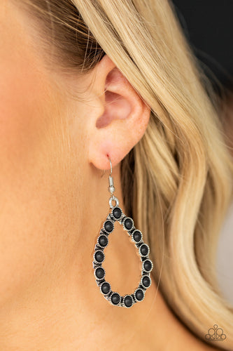 Dainty black stone beads are encrusted along the front of a shimmery silver teardrop, creating a seasonal lure. Earring attaches to a standard fishhook fitting.  Sold as one pair of earrings.  Always nickel and lead free.