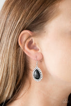 Load image into Gallery viewer, Chiseled into a tranquil teardrop, a smooth black stone is pressed into a shimmery silver frame radiating with tribal inspired textures for a seasonal look. Earring attaches to a standard fishhook fitting.  Sold as one pair of earrings.  Always nickel and lead free.