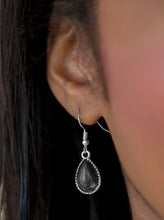 Load image into Gallery viewer, Chiseled into a tranquil teardrop, a polished black stone is pressed into a studded silver frame for a seasonal look. Earring attaches to a standard fishhook fitting.  Sold as one pair of earrings.