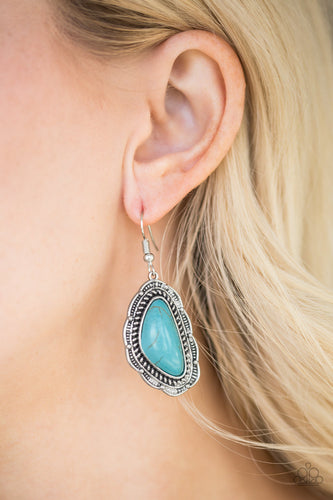 A refreshing turquoise stone is pressed into an ornate silver frame radiating with studded and serrated textures for a seasonal look. Earring attaches to a standard fishhook fitting.  Sold as one pair of earrings.  Always nickel and lead free.