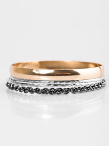 Featuring smooth, serrated, and chain-like patterns, mismatched gold, gunmetal, and silver bangles stack across the wrist for a sassy industrial style.  Sold as one set of four bracelets.