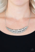 Load image into Gallery viewer, Dotted in sections of glittery white rhinestones, a lifelike silver feather pendant is suspended horizontally below the collar for a seasonal look. Features an adjustable clasp closure.  Sold as one individual necklace. Includes one pair of matching earrings.  Always nickel and lead free.