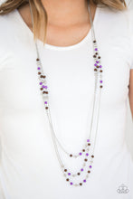 Load image into Gallery viewer, Dainty silver, purple, and wooden beads trickle along three shimmery silver chains, creating colorful layers across the chest. Features an adjustable clasp closure.  Sold as one individual necklace. Includes one pair of matching earrings. Always nickel and lead free.