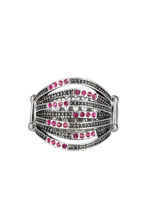 Dotted in sections of glittery pink rhinestones and shimmery silver studs, raised and lowered silver bars stack across the finger for an edgy layered look. Features a stretchy band for a flexible fit.  Sold as one individual ring.