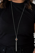 Load image into Gallery viewer, Brushed in an antiqued shimmer, ornate silver beads coalesce into an artisan inspired pendant. Infused with an orange beaded center, the colorful pendant gives way to a shimmery silver tassel for a seasonal finish. Features an adjustable clasp closure.  Sold as one individual necklace. Includes one pair of matching earrings.  