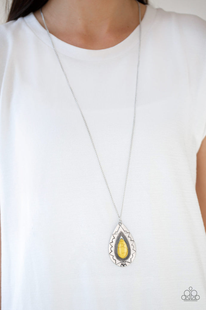 Chiseled into a tranquil teardrop, a sunny yellow stone is pressed into an ornate silver frame. The whimsical pendant swings from the bottom of a lengthened silver chain for a seasonal look. Features an adjustable clasp closure.  Sold as one individual necklace. Includes one pair of matching earrings.  Always nickel and lead free.