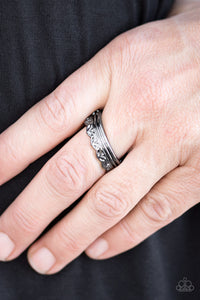 Crowned in a leafy pattern, a dainty gunmetal band arcs across the finger in a seasonal fashion. Features a dainty stretchy band for a flexible fit.  Sold as one individual ring.  Always nickel and lead free.