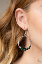 Load image into Gallery viewer,   The bottom of a textured silver hoop is encrusted in glittery green rhinestones for a glamorous look. Earring attaches to a standard fishhook fitting.  Sold as one pair of earrings. Always nickel and lead free.