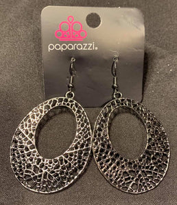 A glistening gunmetal teardrop filigree filled frame swings from the ear for a whimsical look. Earring attaches to a standard fishhook fitting.  Sold as one pair of earrings.