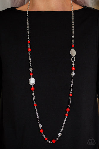 An array of polished red beads, silver discs, and ornate silver accents trickles along a shimmery silver chain for a whimsical look. Features an adjustable clasp closure.  Sold as one individual necklace. Includes one pair of matching earrings. Always nickel and lead free!
