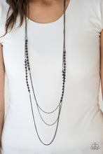Load image into Gallery viewer, Brushed in a metallic sheen, glittery black crystal-like beads join faceted silver beads along layers of shimmery silver chains for a refined look. Features an adjustable clasp closure.  Sold as one individual necklace. Includes one pair of matching earrings.