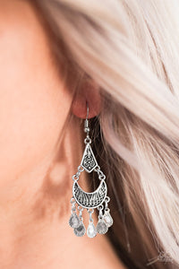 Brushed in a shiny silver finish, ornate teardrops swing from the bottom of a crescent-shaped frame. The shimmery crescent frame attaches to a diamond-shaped frame, creating a flirty tribal lure. Earring attaches to a standard fishhook fitting.  Sold as one pair of earrings.  