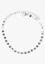 Load image into Gallery viewer, Dainty flat silver discs link across the wrist in an undeniably shimmery fashion. Features an adjustable clasp closure.  Sold as one individual bracelet.