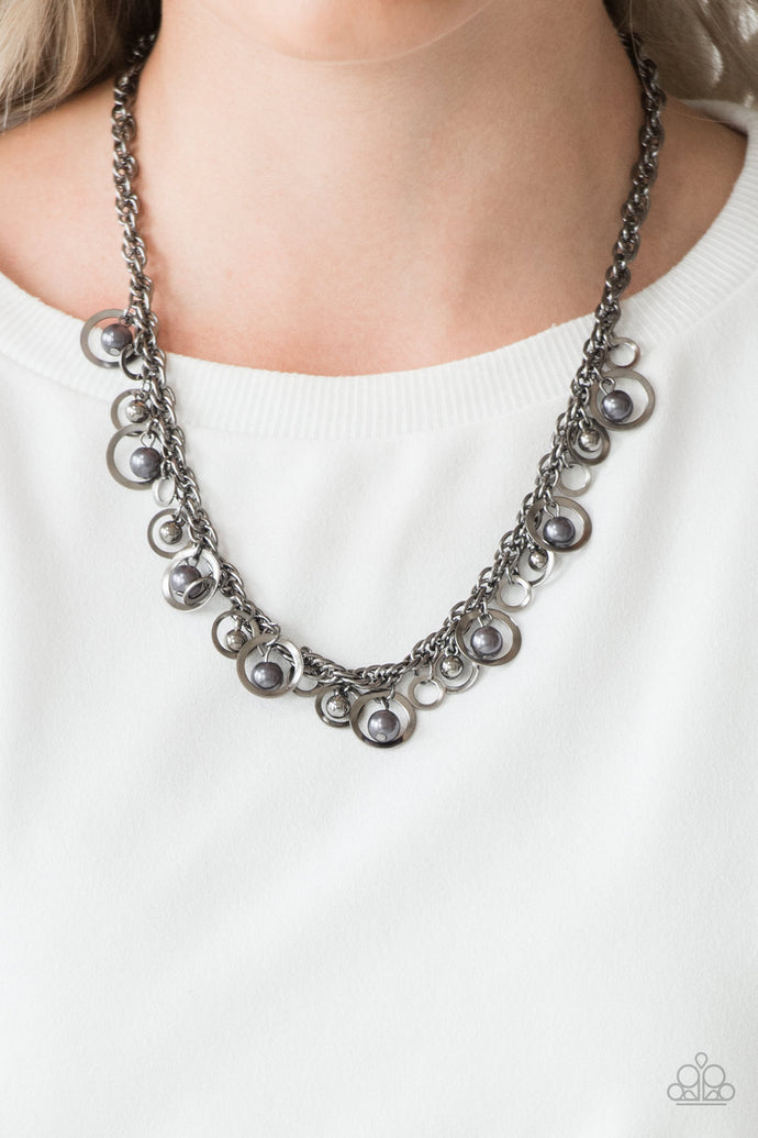Brushed in an antiqued shimmer, mismatched gunmetal hoops, gunmetal pearls, and dainty gunmetal beads swing from the bottom of a bold gunmetal chain below the collar for a refined look. Features an adjustable clasp closure.  Sold as one individual necklace. Includes one pair of matching earrings.  Always nickel and lead free.