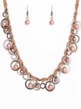 Load image into Gallery viewer, Brushed in an antiqued shimmer, mismatched copper hoops, copper pearls, and dainty copper beads swing from the bottom of a bold copper chain below the collar for a refined look. Features an adjustable clasp closure.  Sold as one individual necklace. Includes one pair of matching earrings.