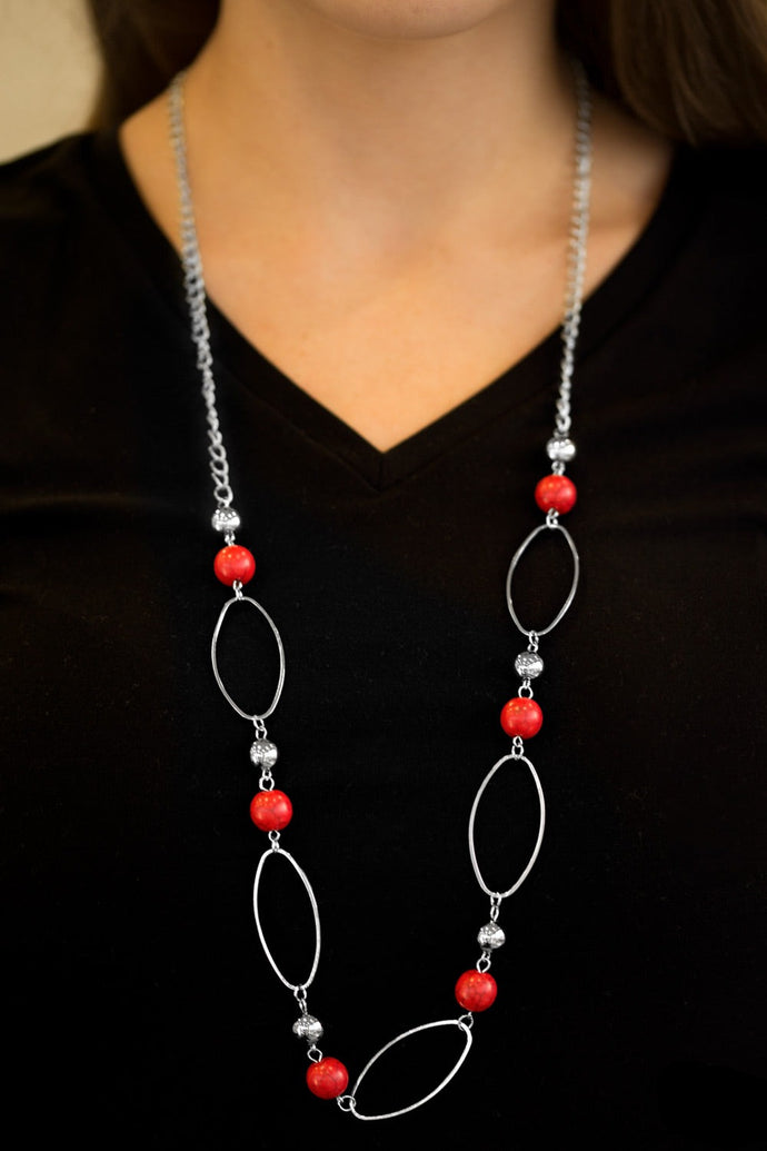 Fiery red stones and classic silver beads join airy silver hoops along a silver chain for a seasonal look. Features an adjustable clasp closure.  Sold as one individual necklace. Includes one pair of matching earrings.