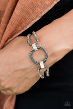 Load image into Gallery viewer, Brushed in an antiqued shimmer, twisting silver bars bend and loop into airy frames. Infused with shimmery silver fittings, the handcrafted frames link across the wrist for an adjustable cuff-like appearance. Features an adjustable clasp closure.  Sold as one individual bracelet.   Always nickel and lead free. 