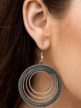 Load image into Gallery viewer, Radiating with smooth, studded, and rope-like textures, a collection of silver hoops ripple into a bold statement piece. Earring attaches to a standard fishhook fitting.  Sold as one pair of earrings.  