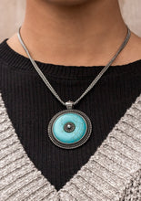 Load image into Gallery viewer, Double strands of silver box chain deftly carry a round turquoise stone set inside an antiqued silver frame. The frame, highlighted with raised dots in concentric circles, repeats inside the center of the turquoise pendant in a mesmerizing finish. Features an adjustable clasp closure.