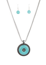 Load image into Gallery viewer, Double strands of silver box chain deftly carry a round turquoise stone set inside an antiqued silver frame. The frame, highlighted with raised dots in concentric circles, repeats inside the center of the turquoise pendant in a mesmerizing finish. Features an adjustable clasp closure.