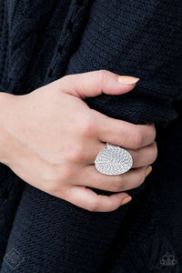 Radiating with hammered detail, a shimmery silver frames sits atop the finger for a simply seasonal look. Features a stretchy band for a flexible fit.  Sold as one individual ring.
