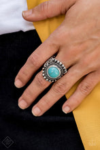 Load image into Gallery viewer, A refreshing turquoise stone is pressed into the center of a round silver frame bordered by shiny silver studs for a rustic look. Features a stretchy band for a flexible fit.   Sold as one individual ring.  Always nickel and lead free.