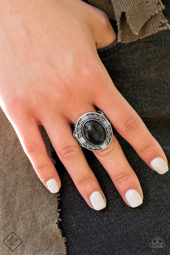 A smooth black stone is pressed into the center of an antiqued silver frame radiating with zigzagging textures for a trendy tribal look. Features a stretchy band for a flexible fit.  Sold as one individual ring.   Simply Santa Fe Fashion Fix  December 2018  Always nickel and lead free. 