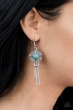 Load image into Gallery viewer,   A refreshing turquoise stone is pressed into a round silver disc that is decorated in linear textures. A tassel of silver chains falls from the bottom of the silver disc, resulting in a design reminiscent of a dreamcatcher. Earring attaches to a standard fishhook fitting.  Sold as one pair of earrings.    Simply Santa Fe Fashion Fix  January 2019   Always nickel and lead free. 