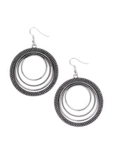 Load image into Gallery viewer, Radiating with smooth, studded, and rope-like textures, a collection of silver hoops ripple into a bold statement piece. Earring attaches to a standard fishhook fitting. Sold as one pair of earrings.